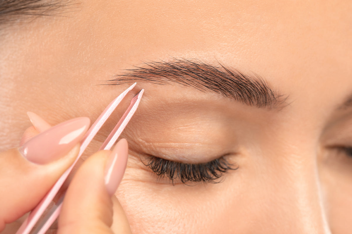 Tweezing eyebrows